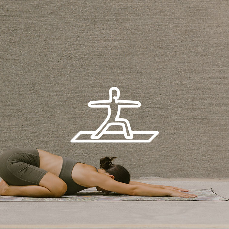 A person practicing yoga on Nomadix towel.